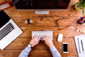 desk-working2-300x200 Business person working at office desk wearing smart watch