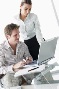 man-on-laptop_Htl3Hk0rj-200x300 Two businesspeople in boardroom with laptop